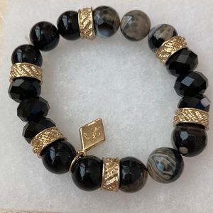NWT- price reduction -black beaded stretch bracelet with gold plated rings